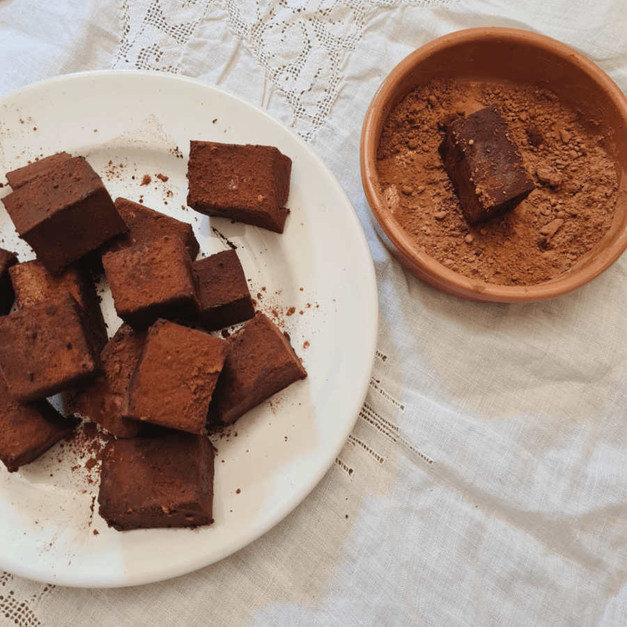 cacao and kefir gelatine jelly cubes on a white lace tablecloth