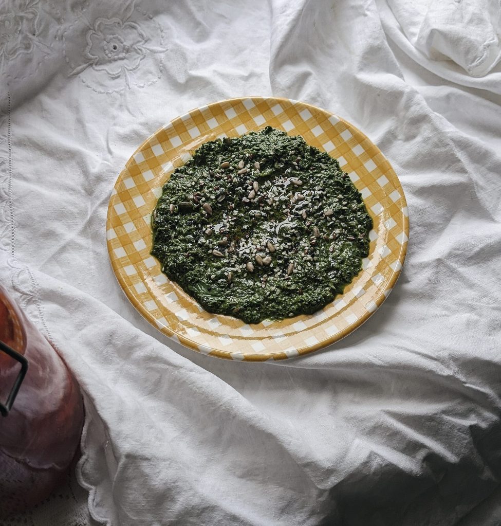 nettle pesto on a yellow gingham plate
